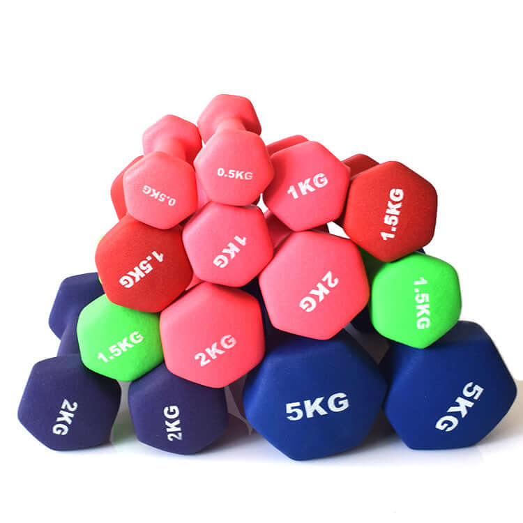 Pile of coated hex dumbbells in red, pink, green and navy, marked from 0.5 to 5 kg