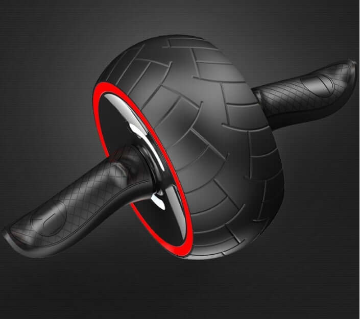 Black ab wheel with a red rim and curved handles on a dark background