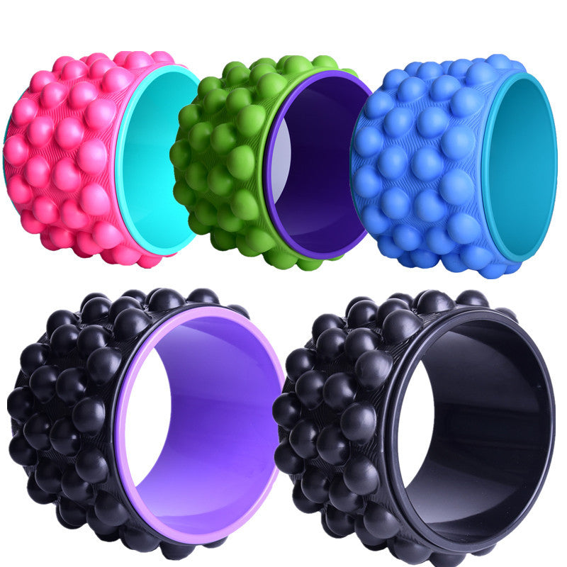 Spiky yoga wheels in pink, green, blue and two black versions with coloured inner rims