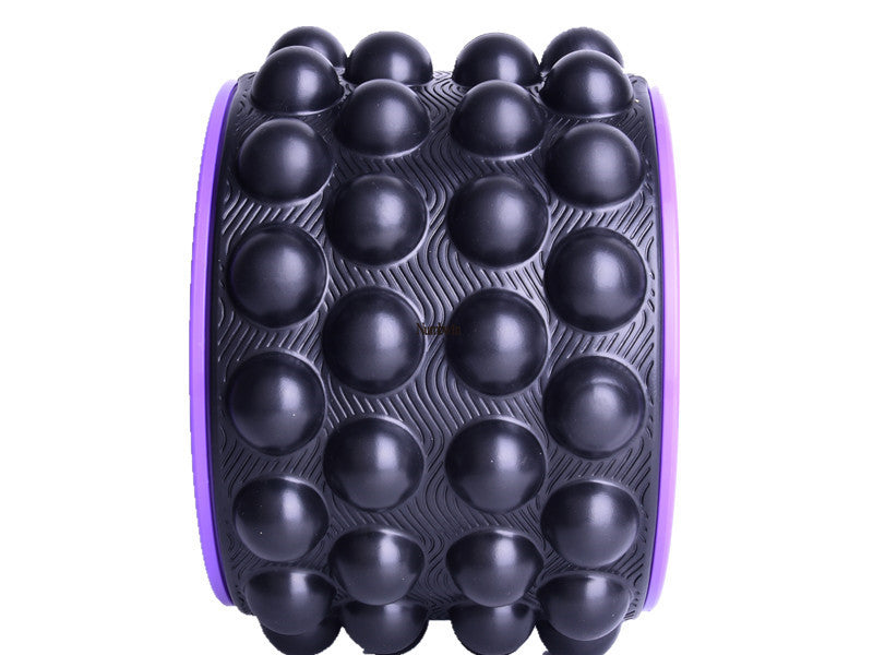 Black spiky yoga wheel seen from the side