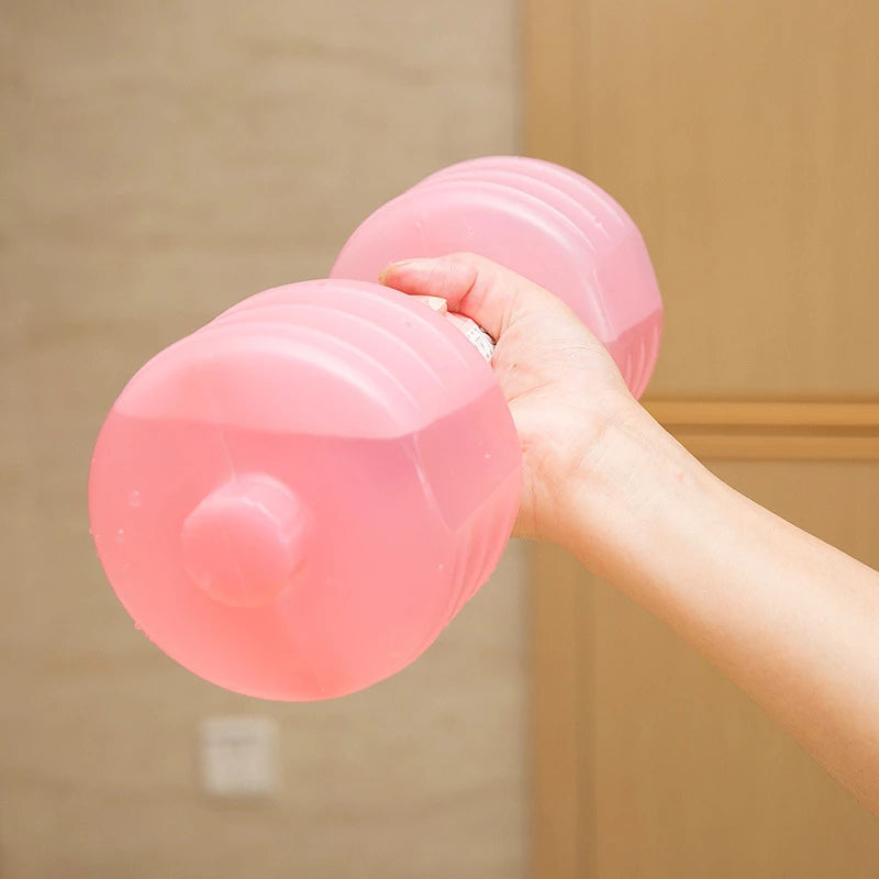 Hand holding a pink water-fill dumbbell filled with water