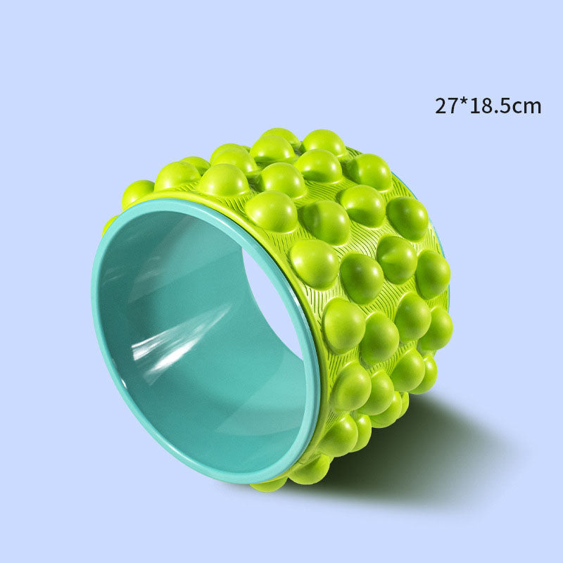 Lime green spiky yoga wheel with a mint inner rim, sized 27 by 18.5 cm