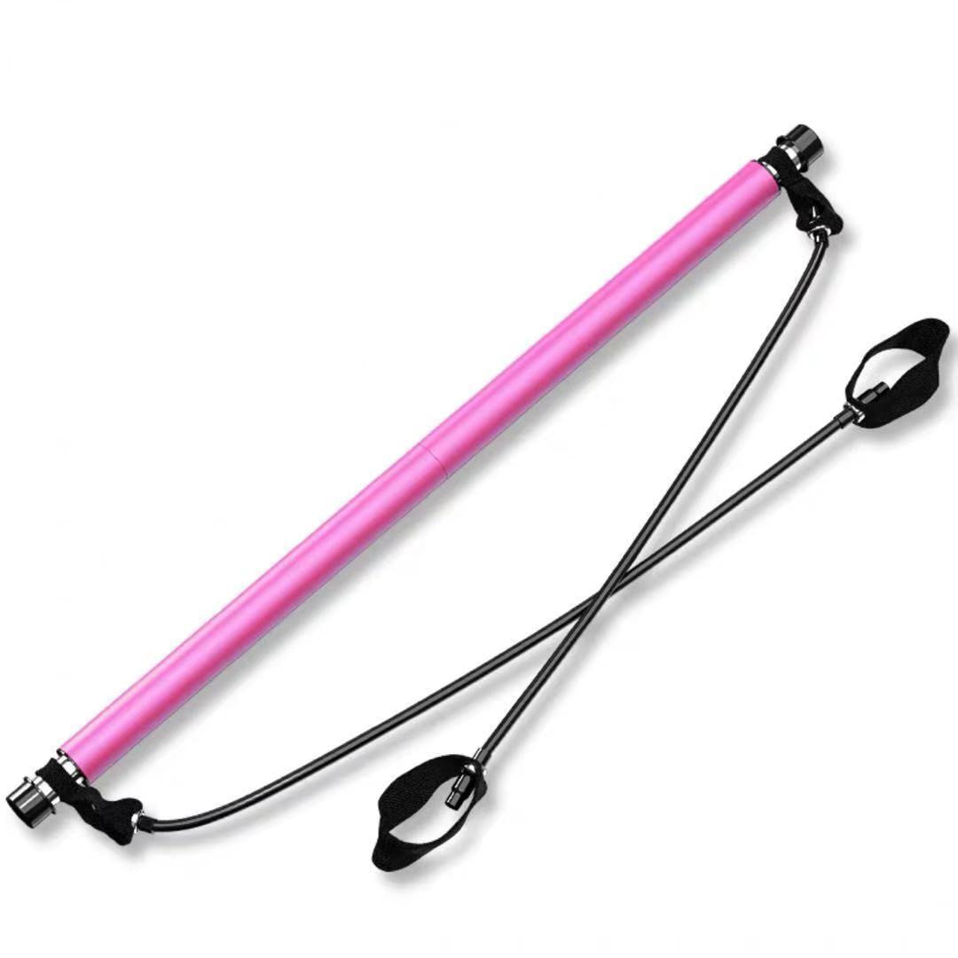 Pink portable Pilates bar with two black resistance cords and padded foot loops