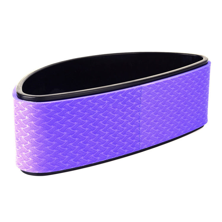 Purple half-moon yoga back trainer standing on its flat side
