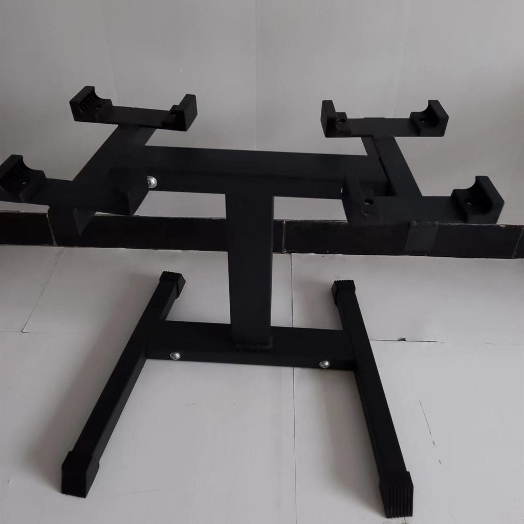 Black steel stand for adjustable dumbbells, empty, on a tiled floor
