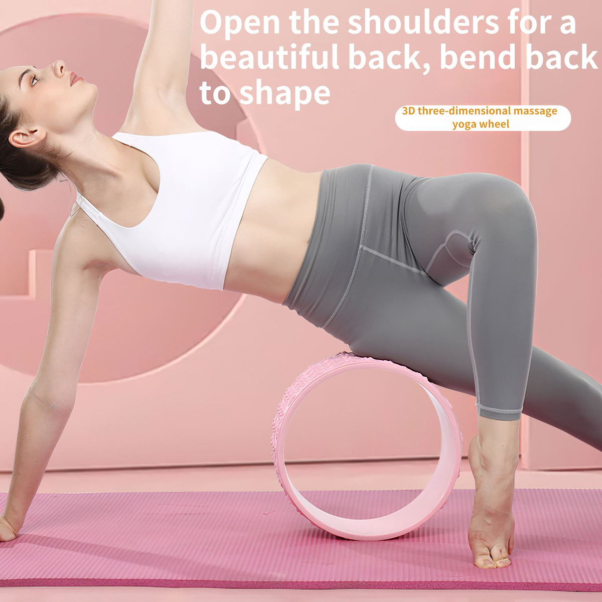 Woman in a side plank backbend over a pink yoga wheel on a mat