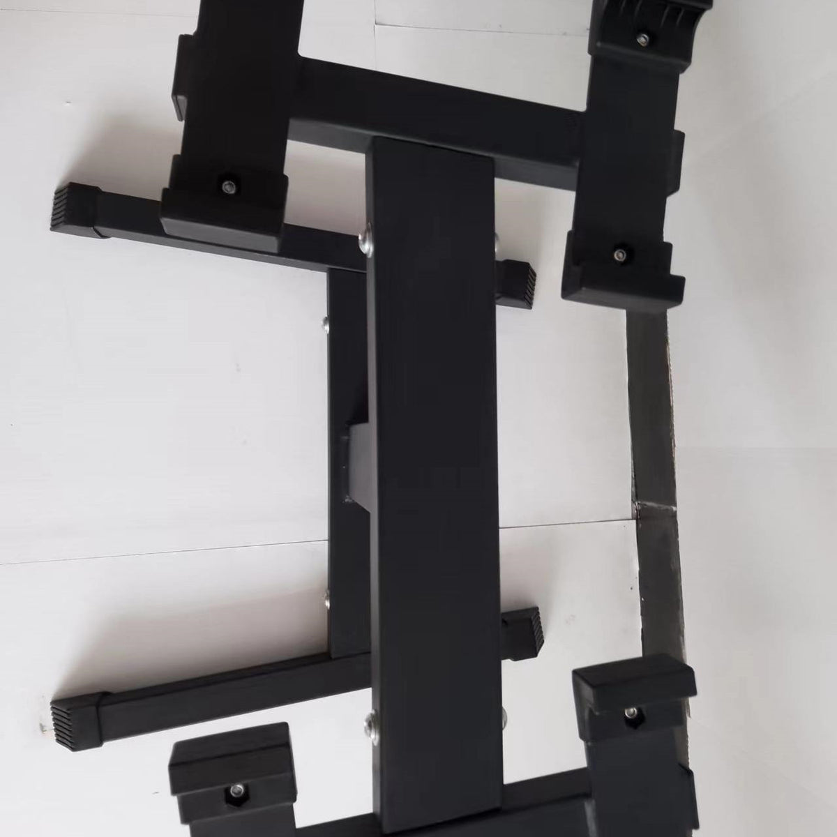 View from above of the black steel dumbbell stand partly assembled