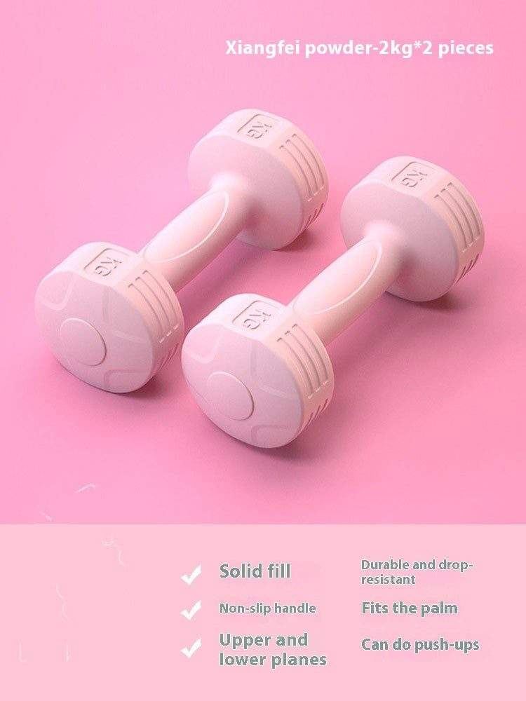 Pair of pink 2 kg soft-touch dumbbells on a pink background
