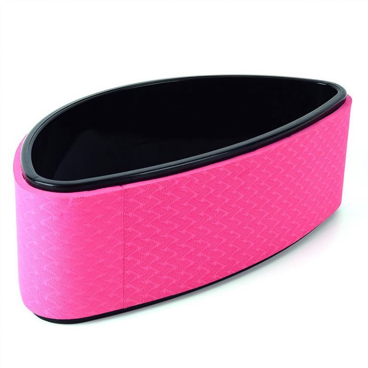 Pink half-moon yoga back trainer with a textured surface and black inner rim