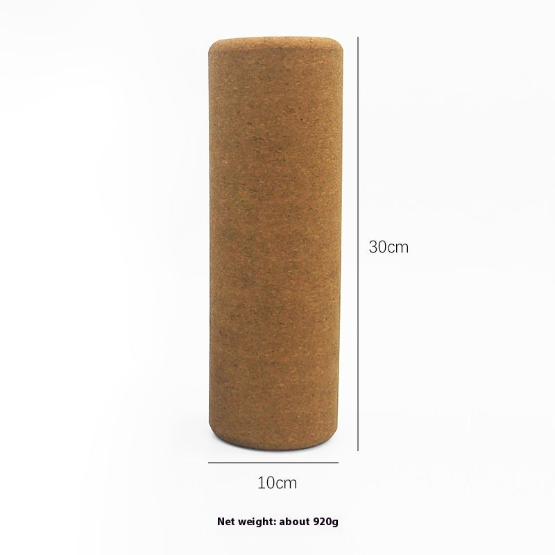 Cork yoga roller standing upright, marked 30 cm long and 10 cm across, net weight about 920 g