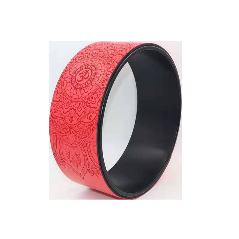 Red yoga wheel with an embossed mandala and om pattern and a black inner rim
