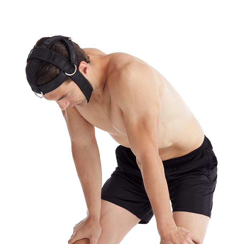 Man bent forward with hands on his knees, wearing a black neck training harness