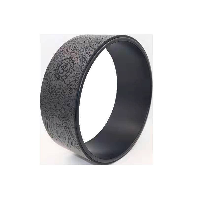 Dark grey yoga wheel with an embossed mandala and om pattern and a black inner rim