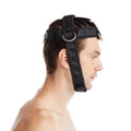 Side view of a man wearing a black neck training harness with metal D-rings