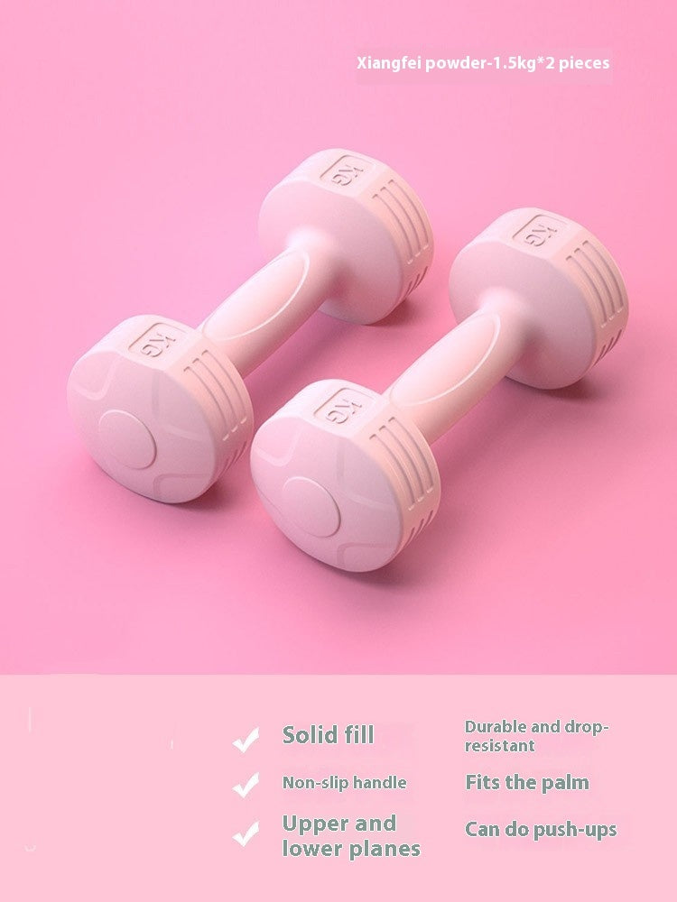 Pair of pink 1.5 kg soft-touch dumbbells on a pink background