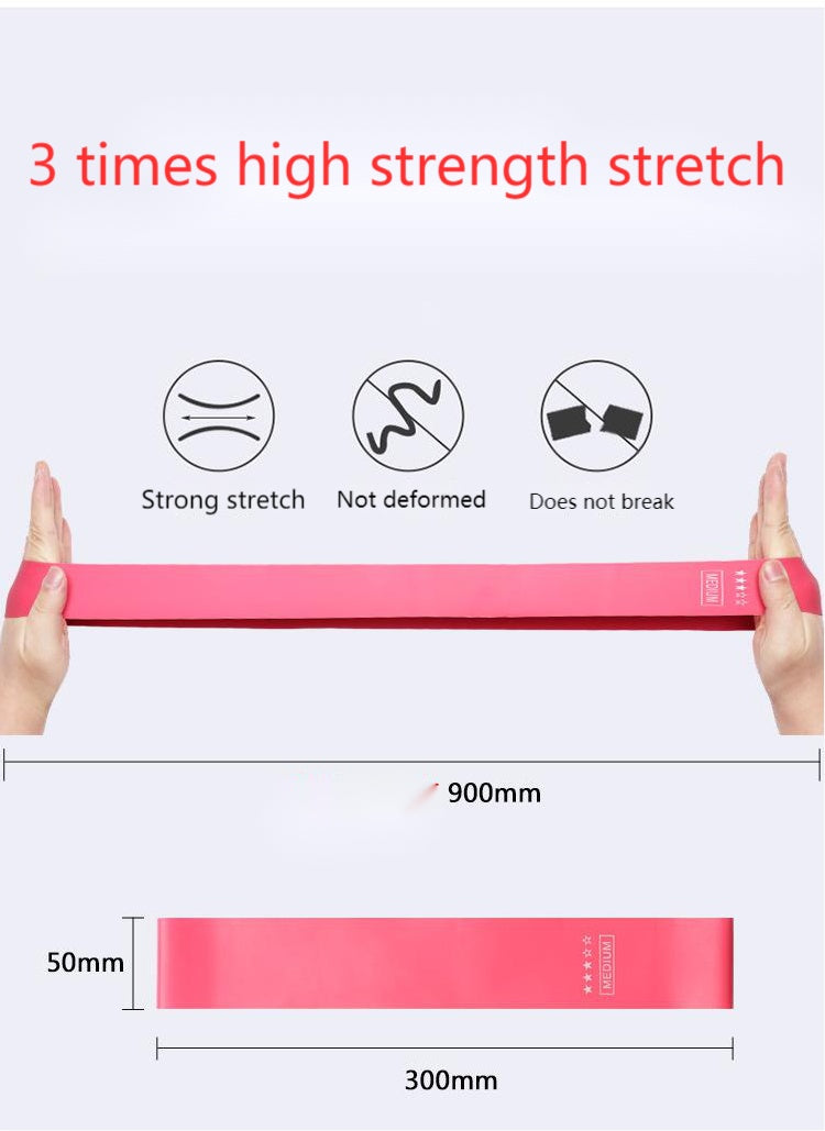 Pink loop band stretched between two hands, with its size marked as 300 by 50 mm