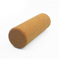 Solid cork yoga roller lying on its side