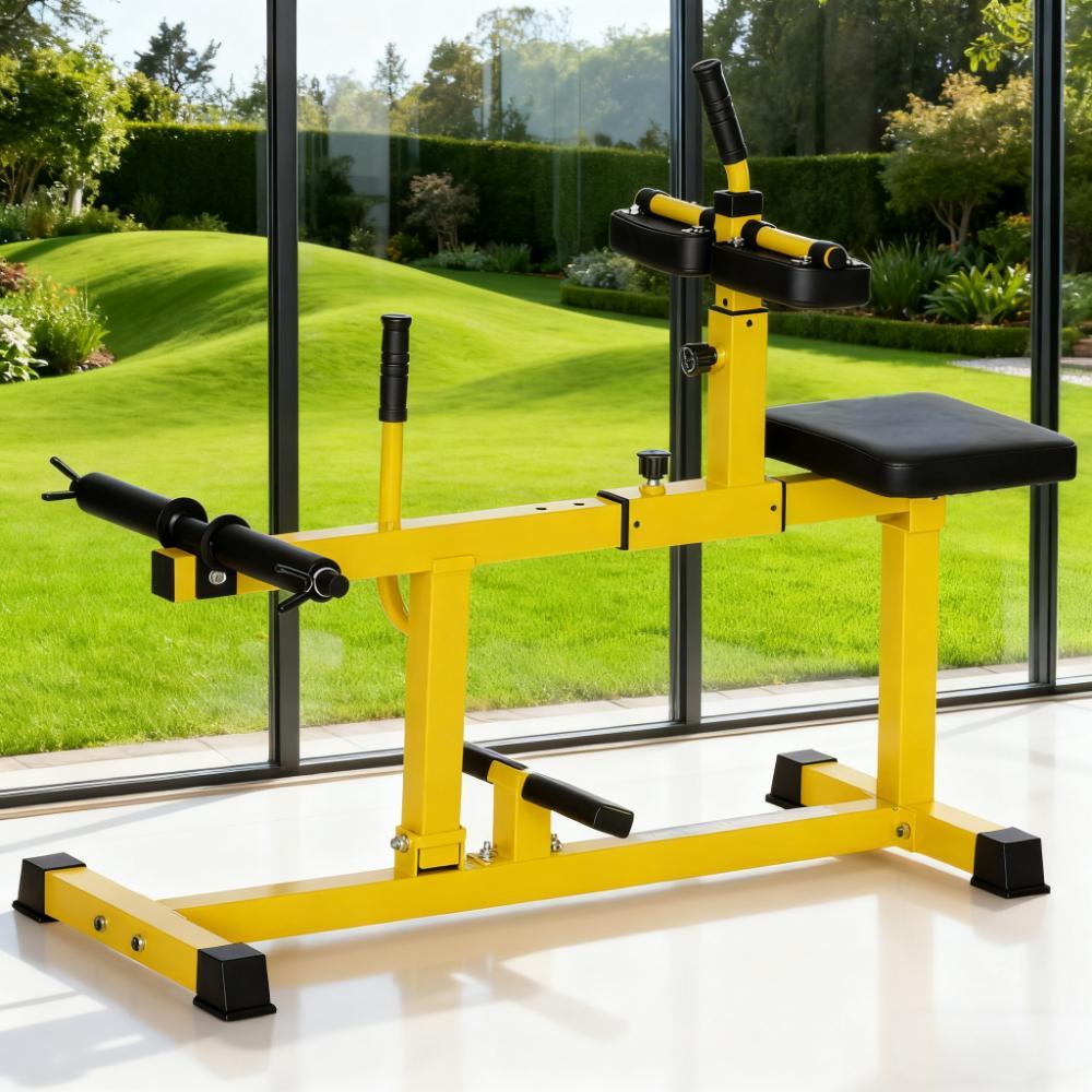 Yellow seated calf raise machine with a black padded seat, knee pad and plate posts