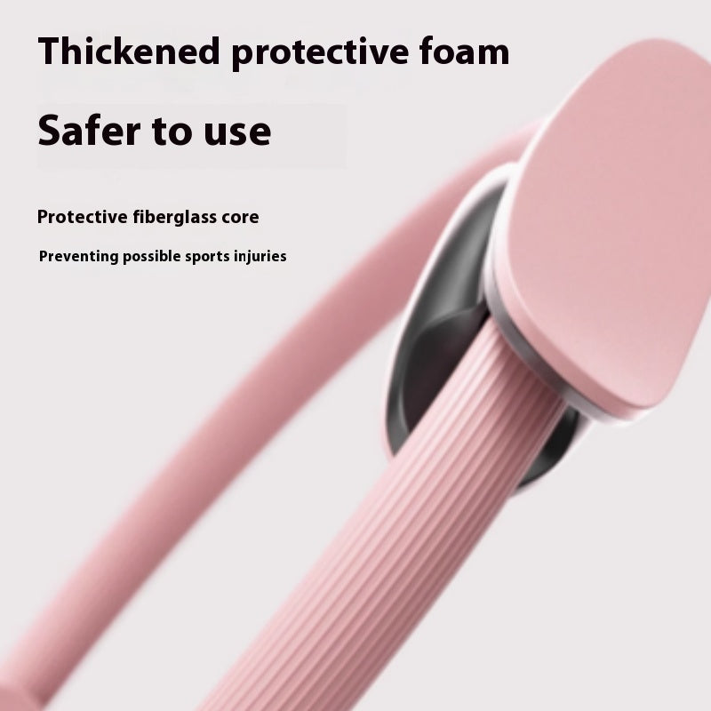 Close-up of the Pilates ring's thick foam handle pad and ribbed grip