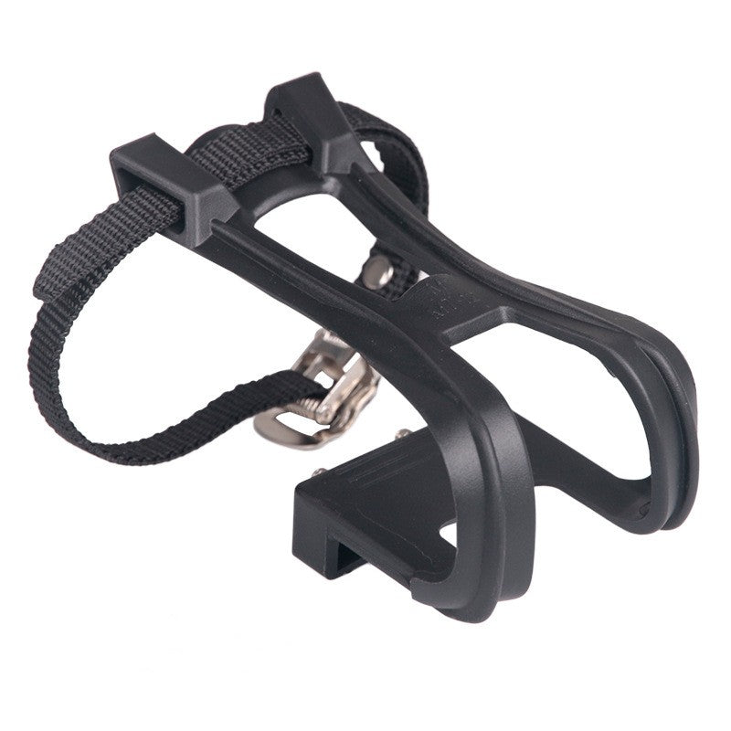 Black plastic toe cage with its strap threaded through and a metal buckle